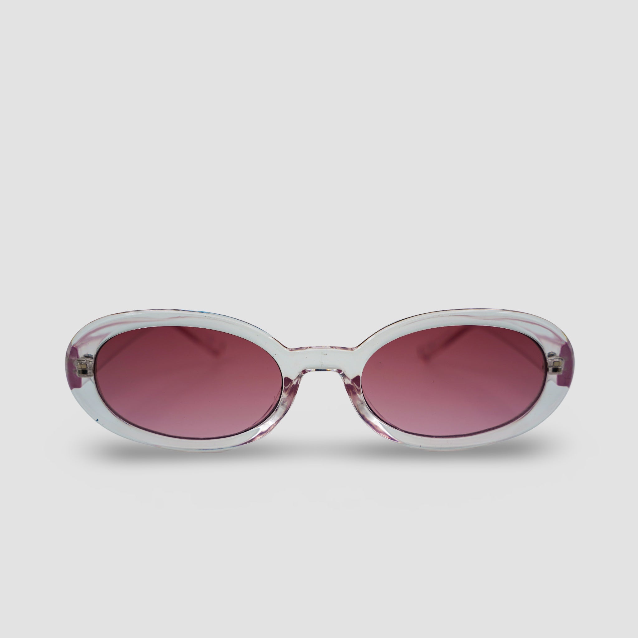 Stijlvolle zonnebril met transparant montuur en roze glazen, perfect voor een trendy look.