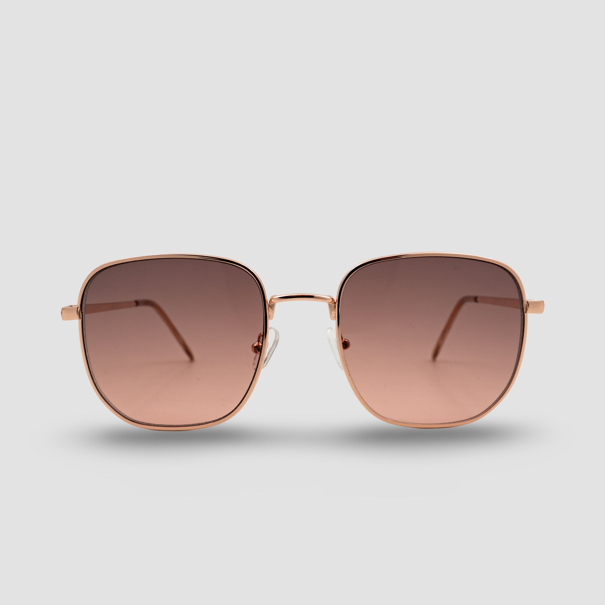 Stijlvolle zonnebril met rosegouden montuur en gradient glazen, perfect voor zomerse dagen.